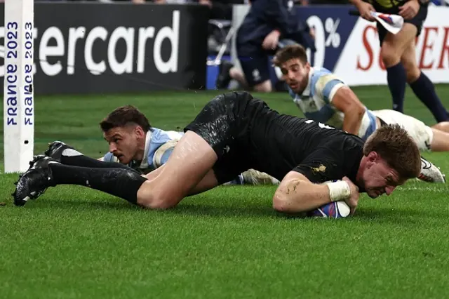 New Zealand's inside centre Jordie Barrett scores a try