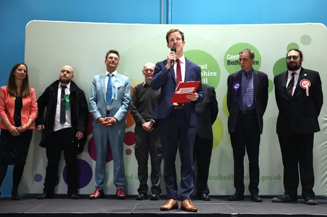 Labour candidate Alistair Strathern (C) speaks to supporters after winning the Mid Bedfordshire by-election with 13,872 votes