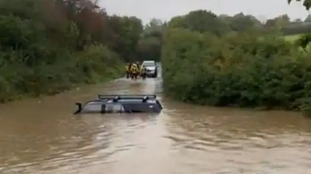 Car in flood water in Trowell