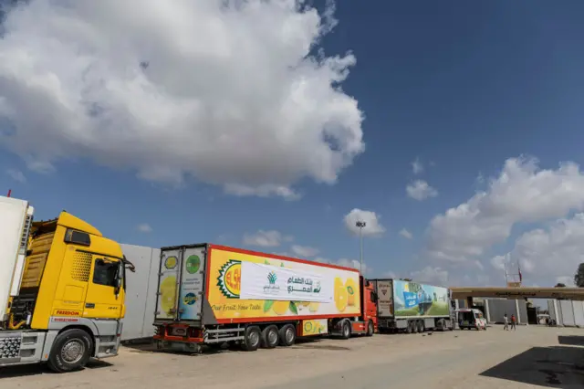 Aid convoy trucks lined up at the Rafah border crossing