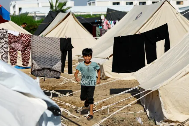 This boy is one of many Palestinians who are taking shelter in a tent camp run by the UN in southern Gaza