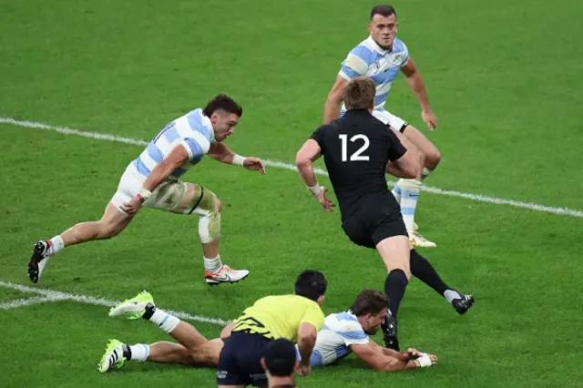 New Zealand's inside centre Jordie Barrett (black jersey) runs on his way to scoring a try