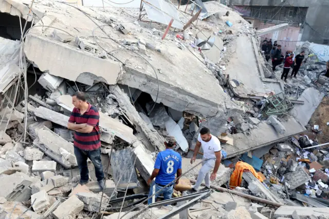 Palestinians search the destroyed annex of the Greek Orthodox Saint Porphyrius Church, the oldest church still in use in Gaza, damaged in a strike on Gaza City on October 20, 2023.