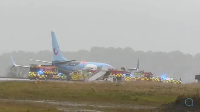 Fire engines surround plane