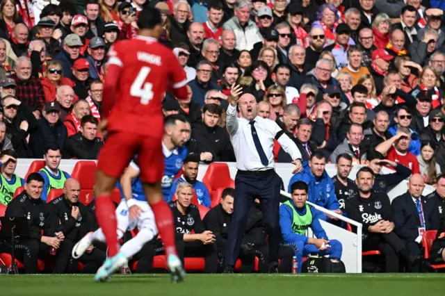 Everton's English manager Sean Dyche shouts instructions to the players from the touchline