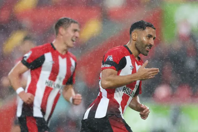 Saman Ghoddos of Brentford celebrates after scoring the team's third goal