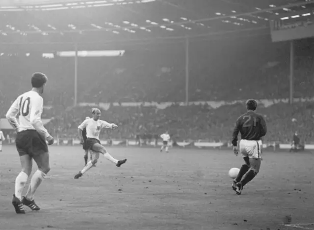 Sir Bobby Charlton scores the winning goal for England against Portugal in the 1966 World Cup semi-final