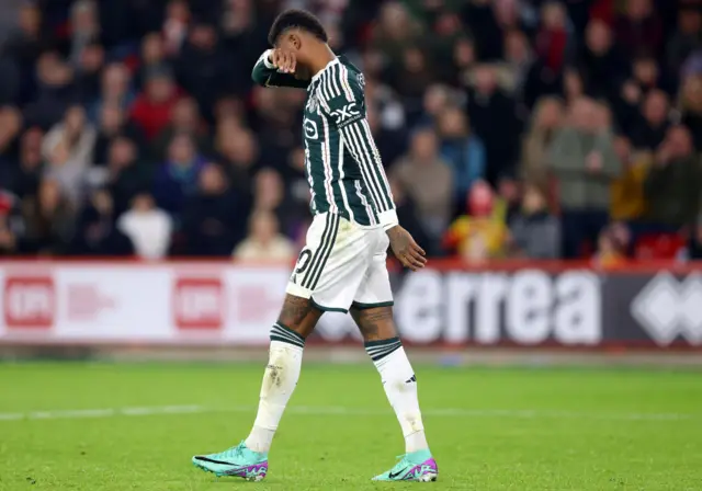 Rashford trudges off the pitch after being subbed.