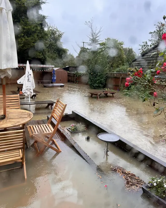 A flooded patio and garden area at the pub