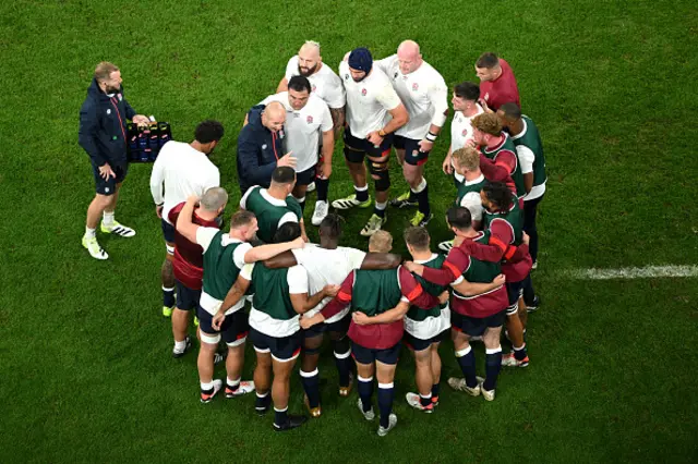 The players of England form a huddle