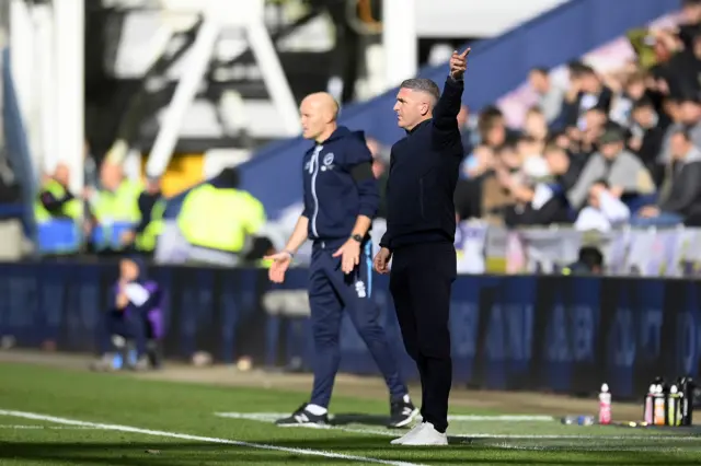 Preston boss Ryan Lowe and Millwall caretaker boss Adam Barrett on the touchline