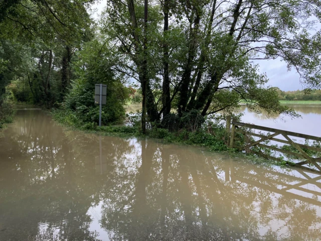 Flooded road and field in Colton, Norfolk