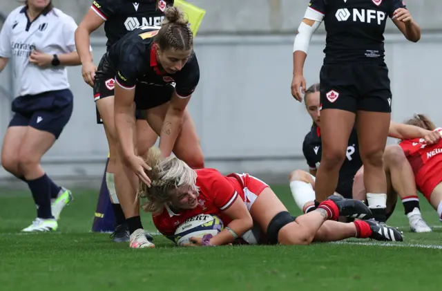 Alex Callender crosses for Wales' third