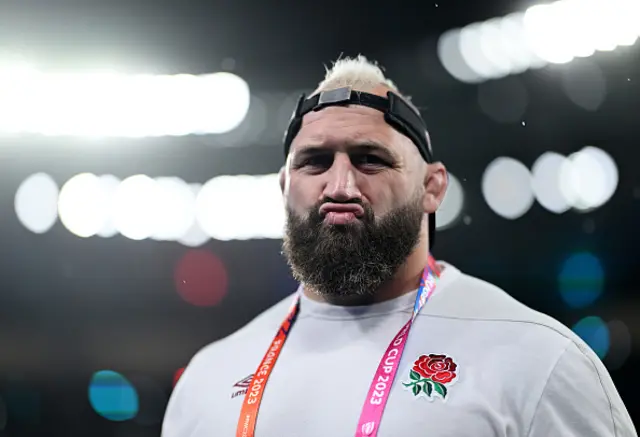 Joe Marler of England inspects the pitch