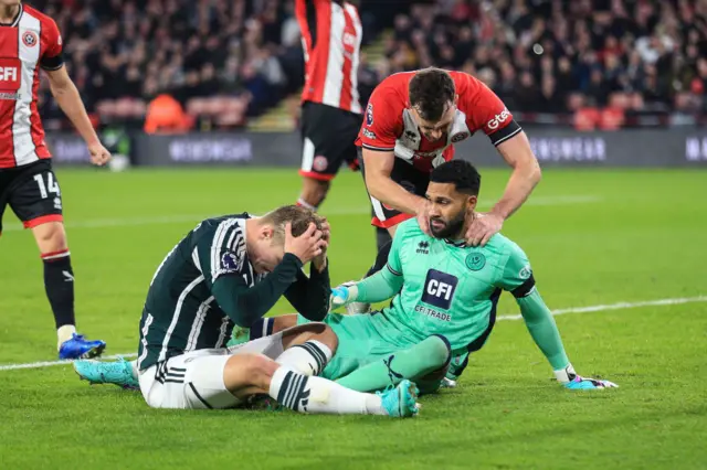 Foderingham is congratulated by his defenders after a smart save.