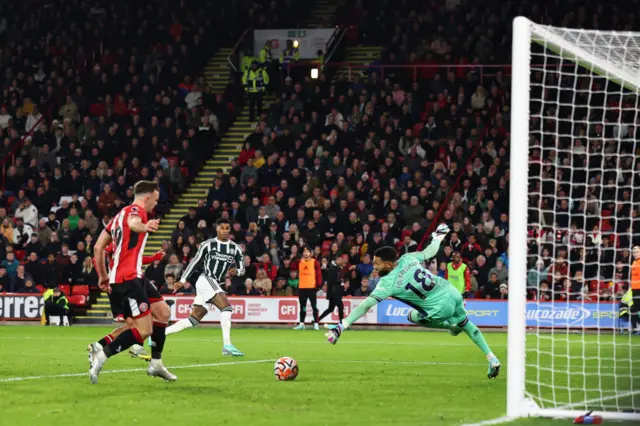 Rashford fires just wide of the target.