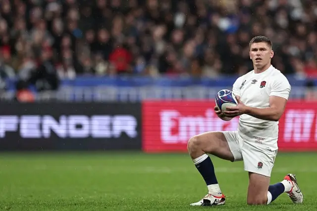 England's fly-half and captain Owen Farrell prepares to convert