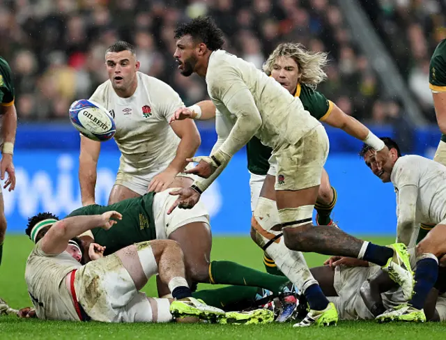 Courtney Lawes of England passes the ball