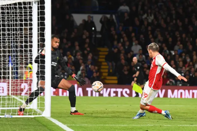 Trossard taps home past Sanchez to equalise.