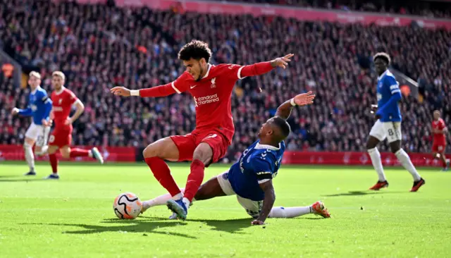 uis Diaz of Liverpool brought down by Ashley Young