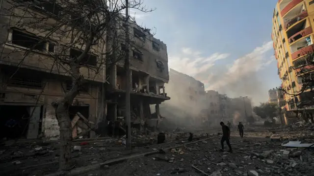 Palestinians inspect a destroyed area following an Israeli airstrike in Gaza, 21 October 2023. More than 4,000 Palestinians and 1,400 Israelis have been killed, according to the Israel Defense Forces (IDF) and the Palestinian health authority, since Hamas militants launched an attack against Israel from the Gaza Strip on 07 October.