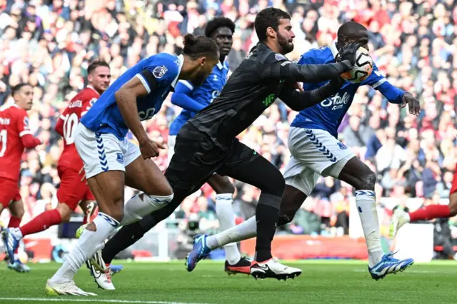 Alisson with the ball