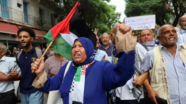 People gather during a protest to express solidarity with Palestinians in Gaza