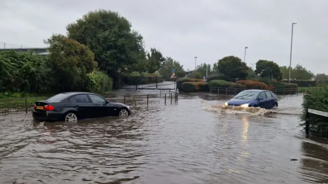 Cars in floodwater in Llandudno, Conwy county