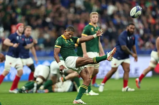 South Africa's fly-half Manie Libbok kicks the ball