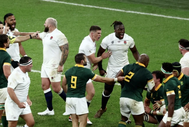 England celebrate winning the ball back