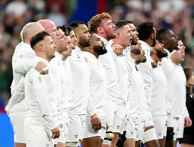 The players of England line up