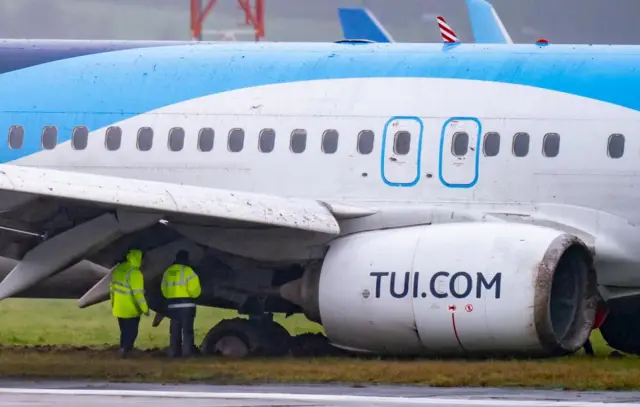 A plane that has skidded off a runway