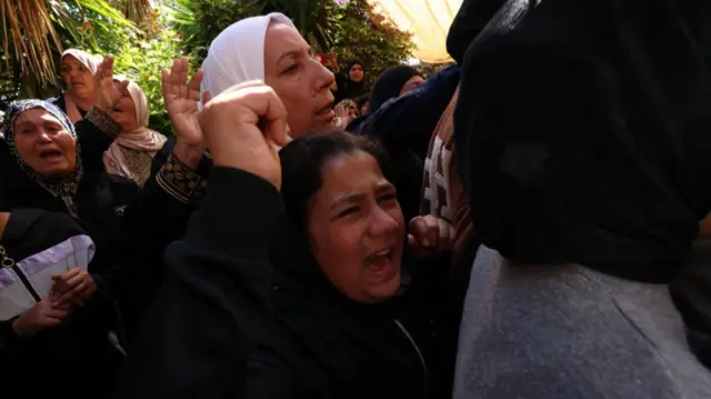 Palestinians mourn the death of relatives in the West Bank