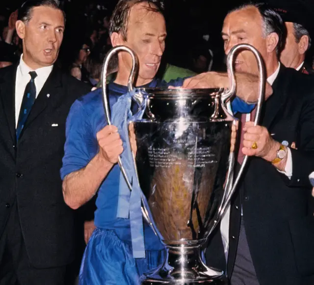 Charlton holds the European Cup after scoring twice in the final.