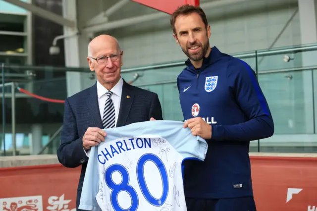 Gareth Southgate presents Sir Bobby Charlton with a special England shirt to mark his 80th birthday