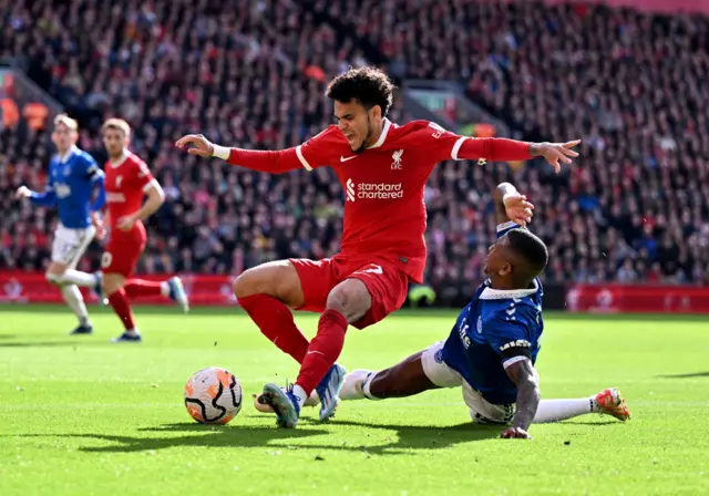 uis Diaz of Liverpool brought down by Ashley Young