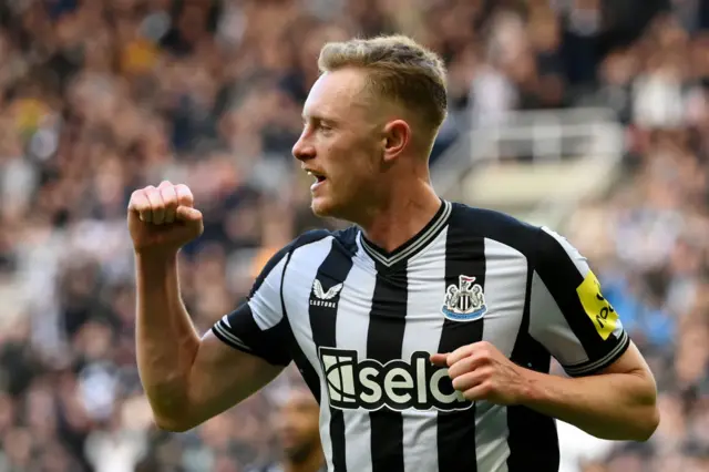 Sean Longstaff of Newcastle United celebrates after scoring the team's third goal