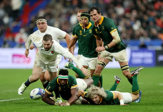 Siya Kolisi of South Africa is tackled by Elliot Daly