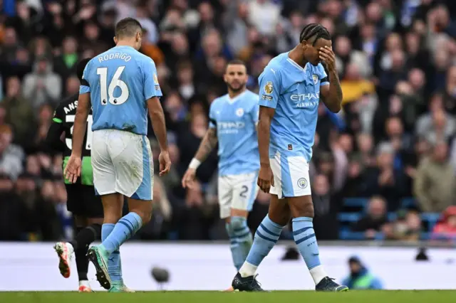 Manuel Akanji reacts as he leaves the pitch after being shown a red card