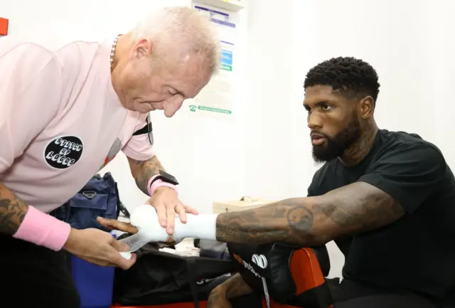 Mikael Lawal gets his hands wrapped