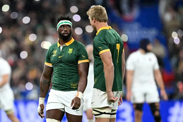 Siya Kolisi of South Africa interacts with teammate Pieter-Steph Du Toit