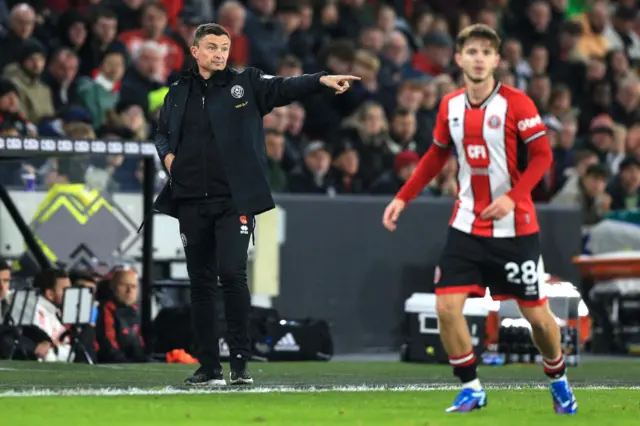 Paul Heckingbottom points instructions onto the pitch.