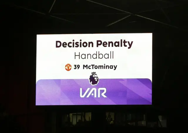 The scoreboard signals a VAR check for a penalty.