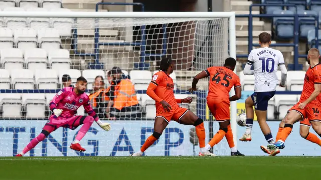 Preston's Mads Frokjaer scores against Millwall