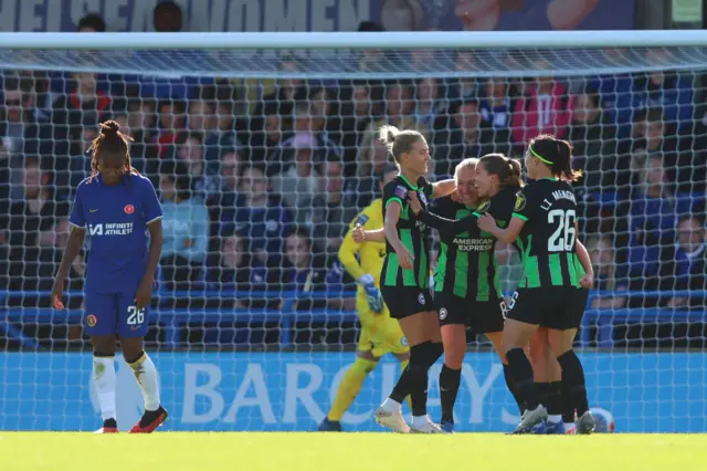 auline Bremer of Brighton & Hove Albion celebrates with team mates after scoring the team's first goal