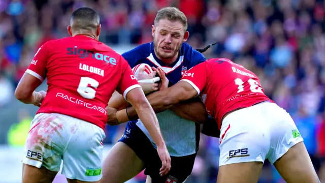 Tom Burgess carries the ball for England