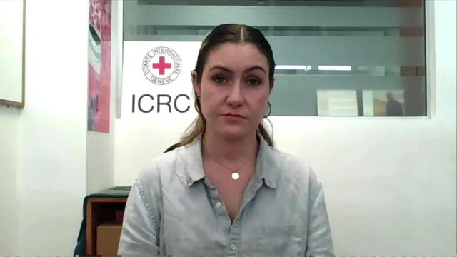 Sarah Davies from the ICRC sits in an office