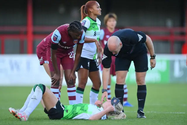 Sophie Roman Haug of Liverpool goes down with an injury