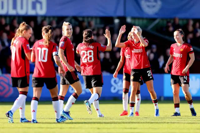 Rachel Williams of Manchester United celebrates with Millie Turner