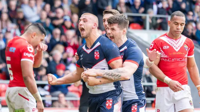 Mikey Lewis celebrates a try